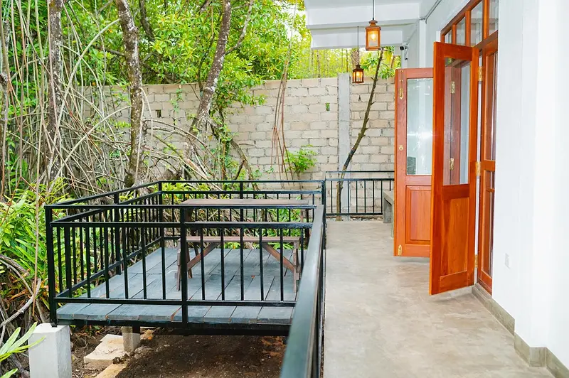 Deck and entrance of the ground-floor room beside the mangroves