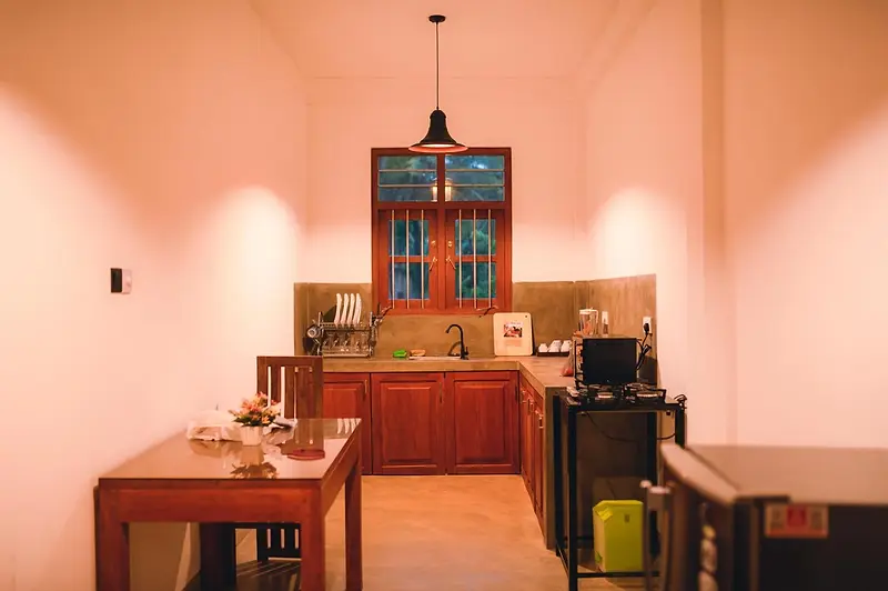 Kitchen and dining area lit for the evening