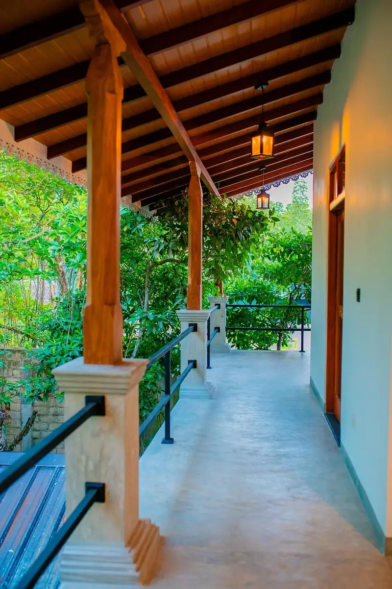 Timber-beamed veranda running along the upper floor