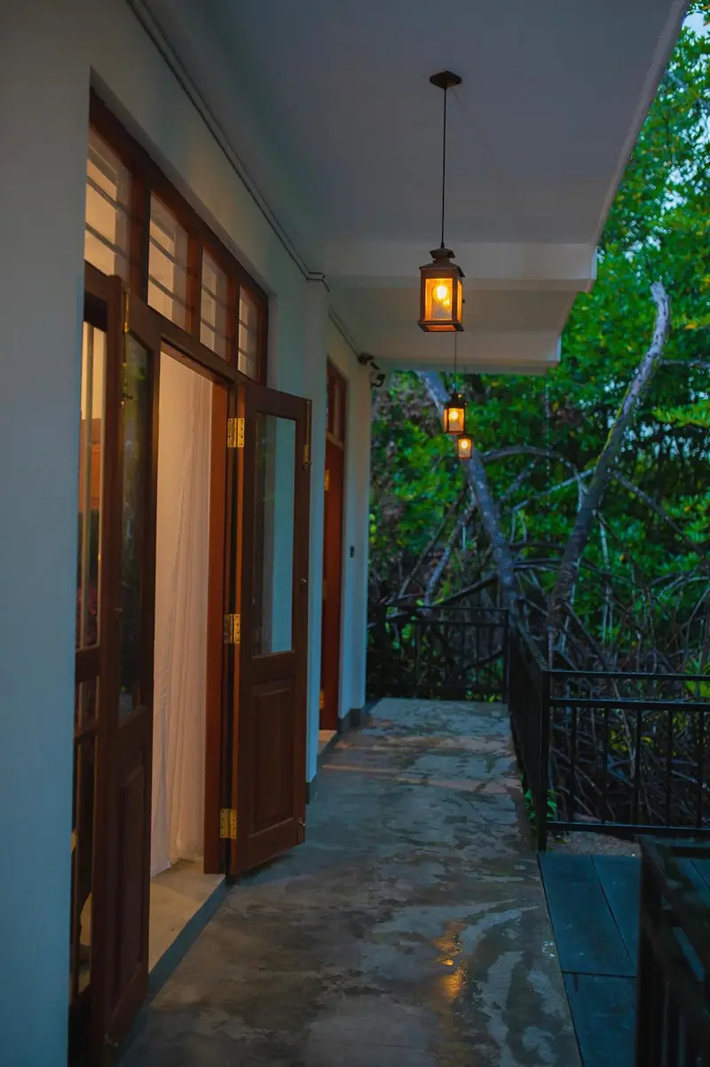 Covered walkway along the ground floor at dusk